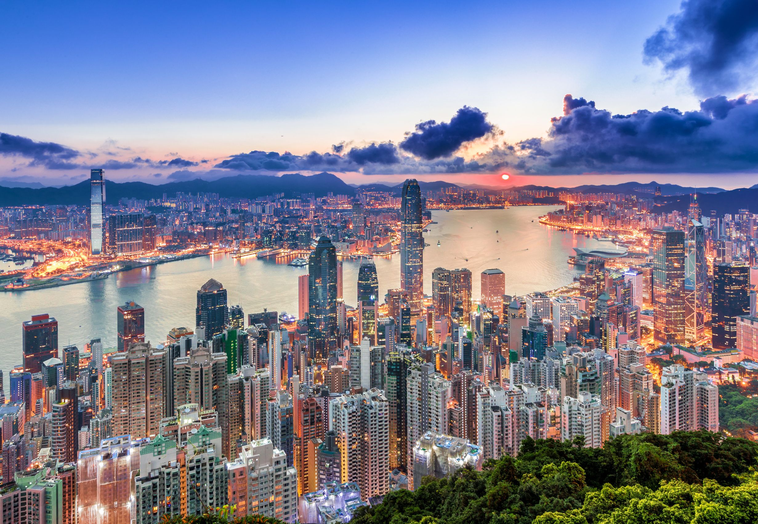 Hong Kong skyline and Victoria Harbour at dusk.